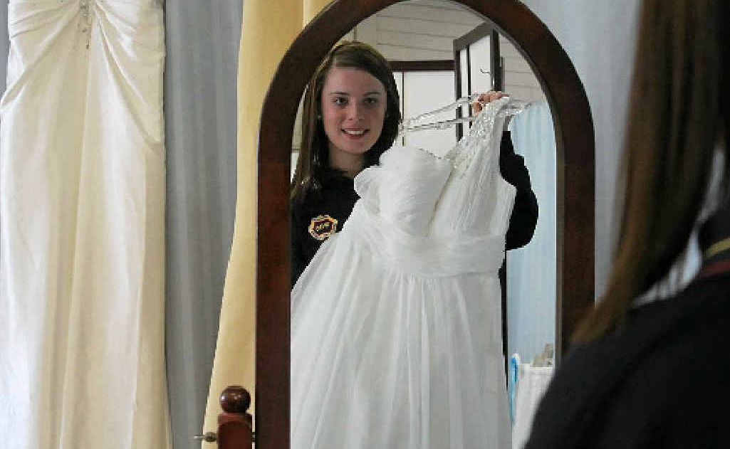 Caledonian debutante 16-year-old Demi Quirk takes a moment at Glamourous Brides to be sure she has chosen the right dress for her big night. Caledonian debutante 16-year-old Demi Quirk takes a moment at Glamourous Brides to be sure she has chosen the right dress for her big night.